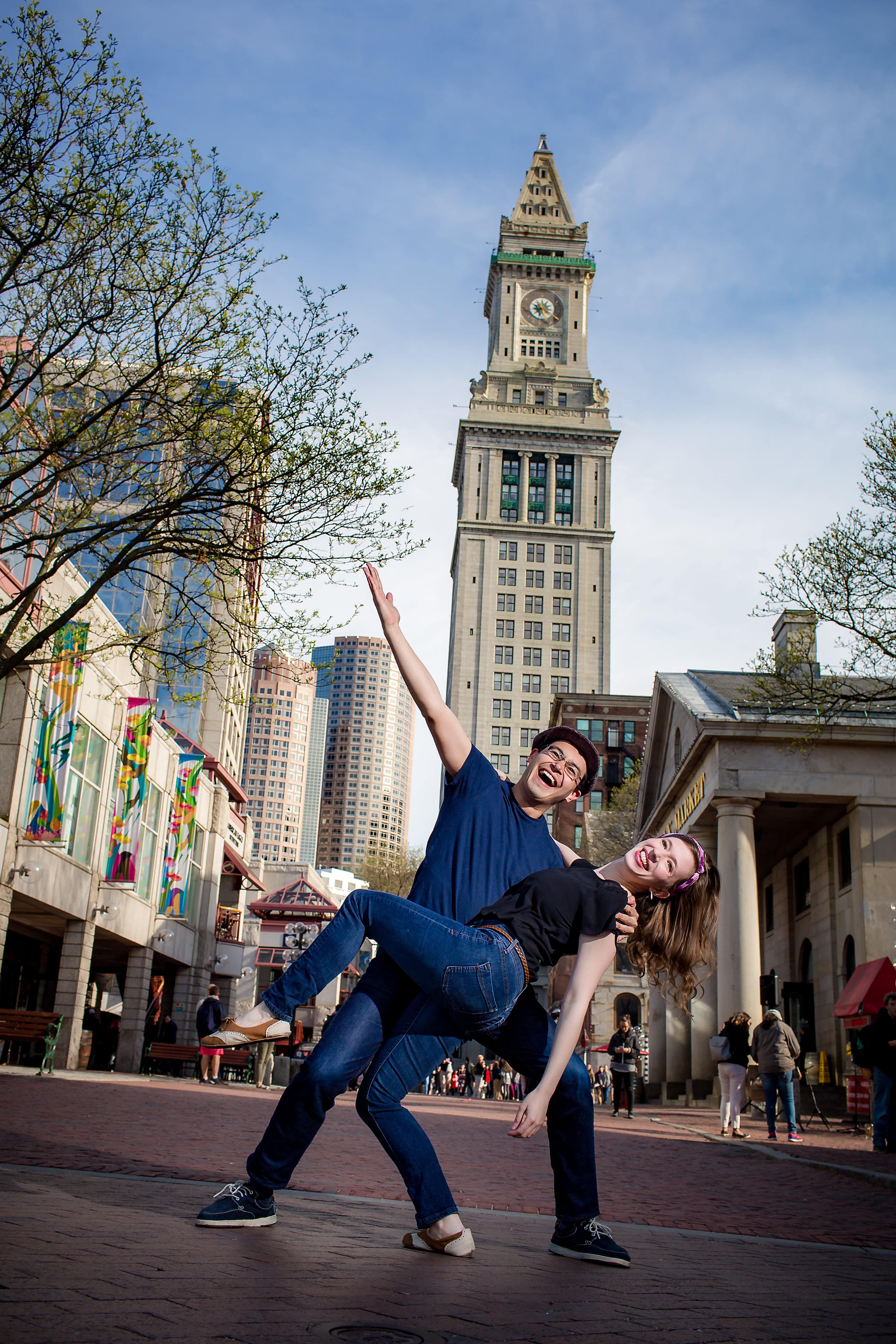 Andrew Selzer and Cari Meisel dancing in front of the Boston Custom House