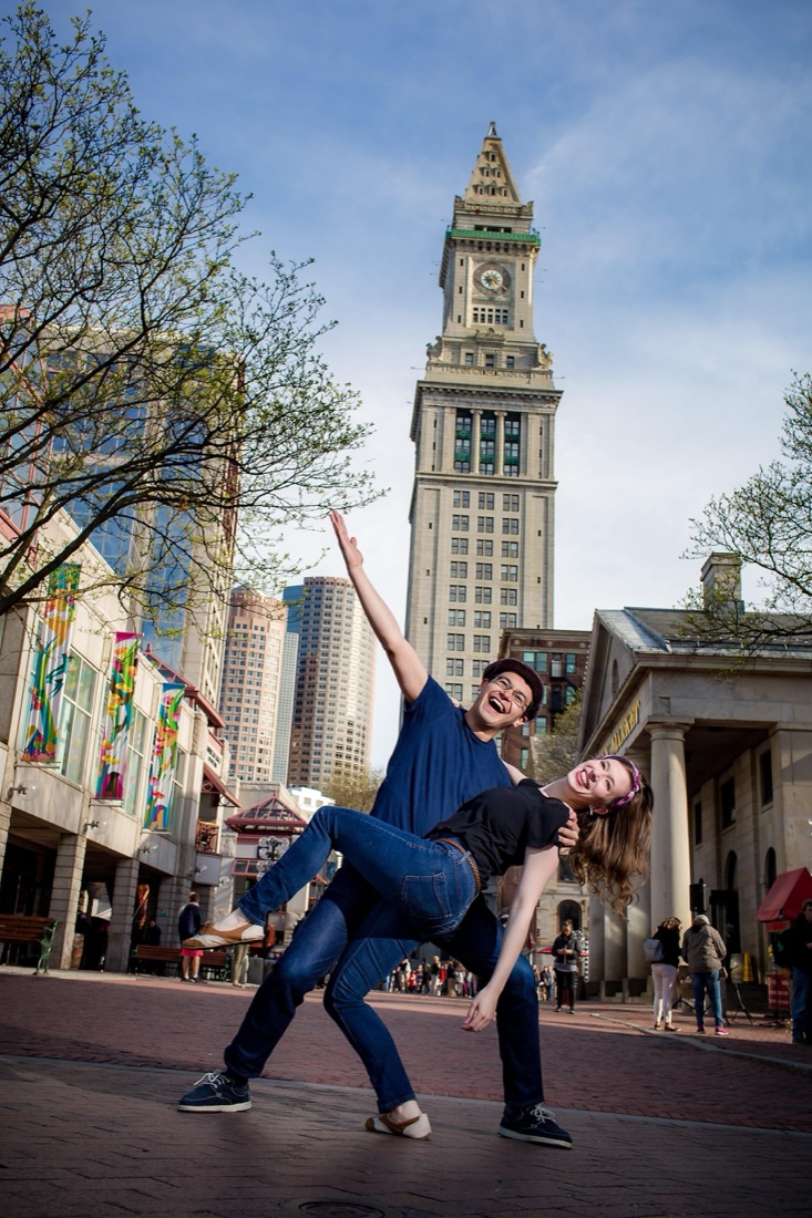 Andrew Selzer and Cari Meisel dancing in front of the Boston Custom House