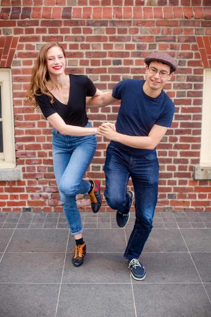 Katie Piselli and Andrew Selzer dancing in front of Boston Old State House